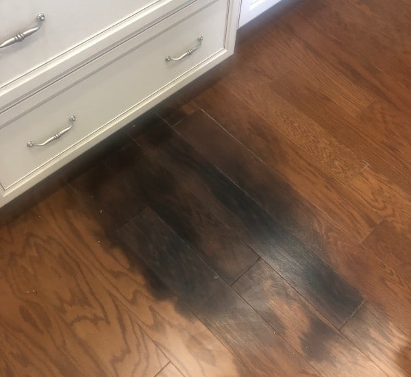 Why are my hardwood floors turning black?